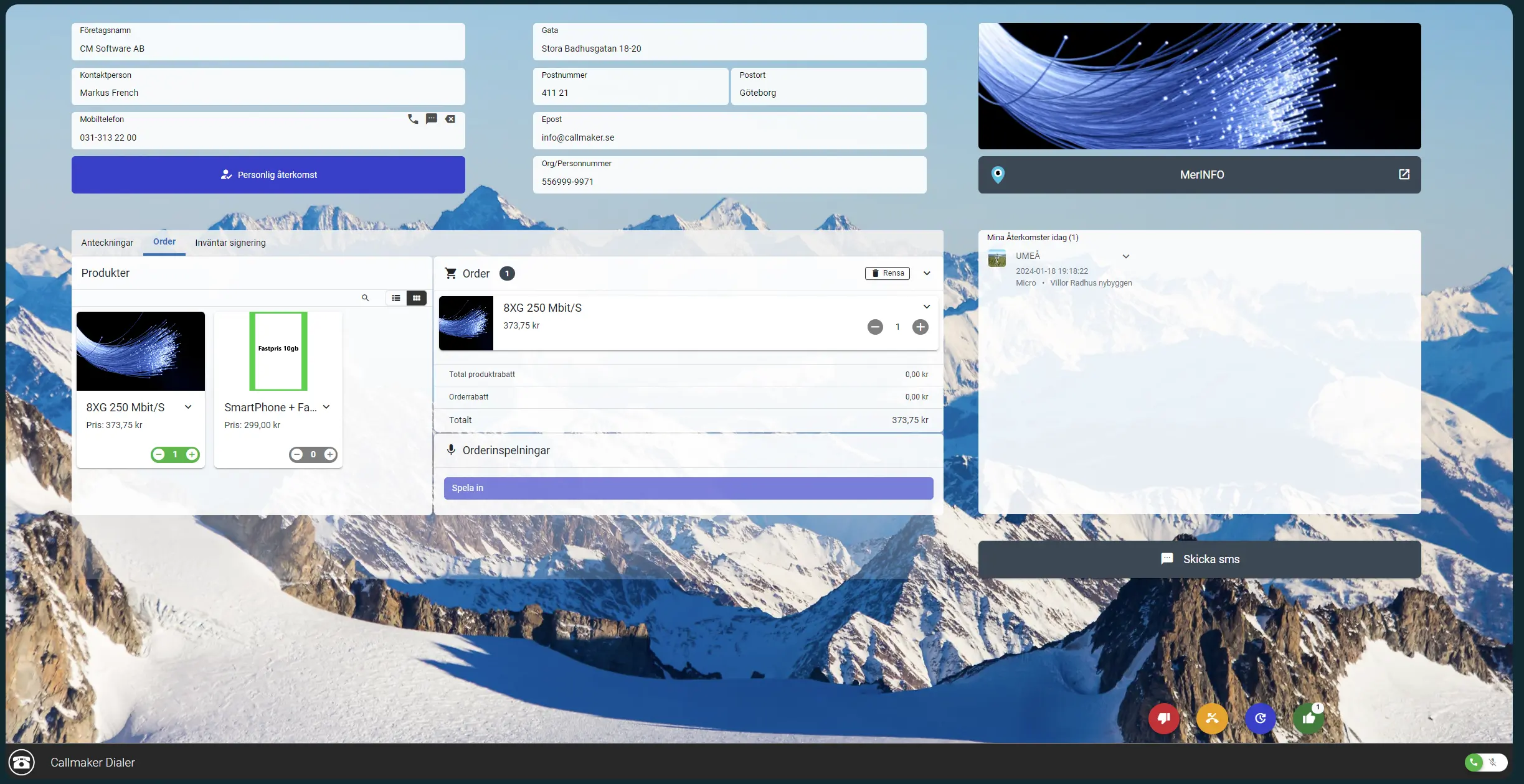 Laptop med Callmakers outbound dialer öppen, mot en bergsvy